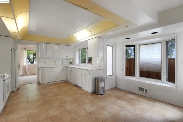 a bathroom with a toilet a sink a mirror and vanity