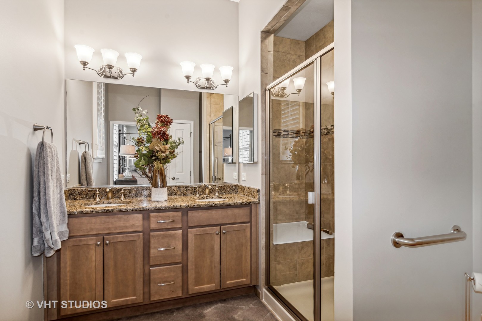 3870 Eagle Ridge Drive Elgin, IL 60124 - Photo 14 of 20 a bathroom with a granite countertop sink a mirror and a shower