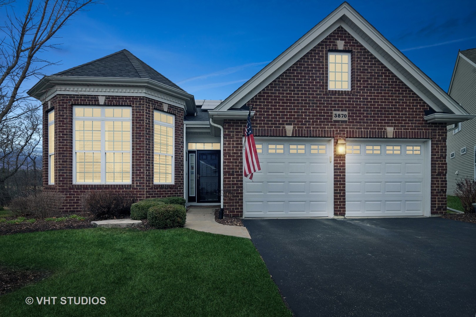 3870 Eagle Ridge Drive Elgin, IL 60124 - Photo 2 of 20 a front view of a house with a garden