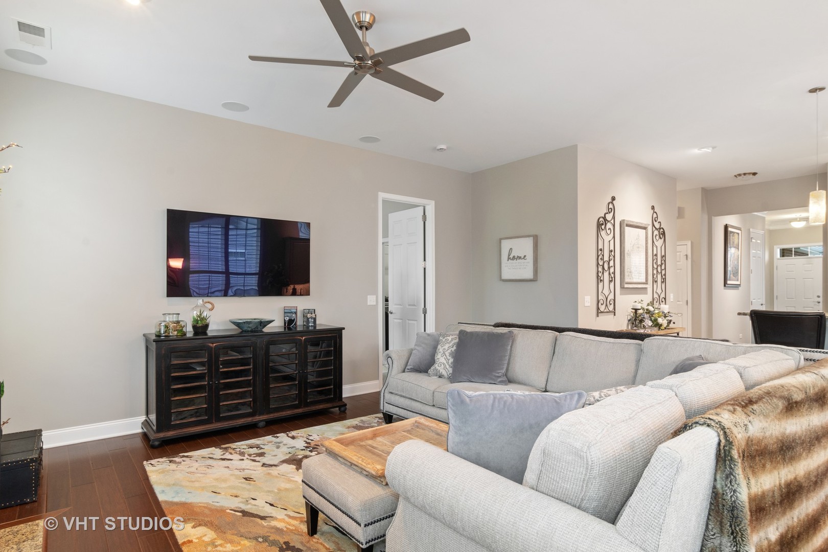 3870 Eagle Ridge Drive Elgin, IL 60124 - Photo 6 of 20 a living room with furniture a ceiling fan and a rug