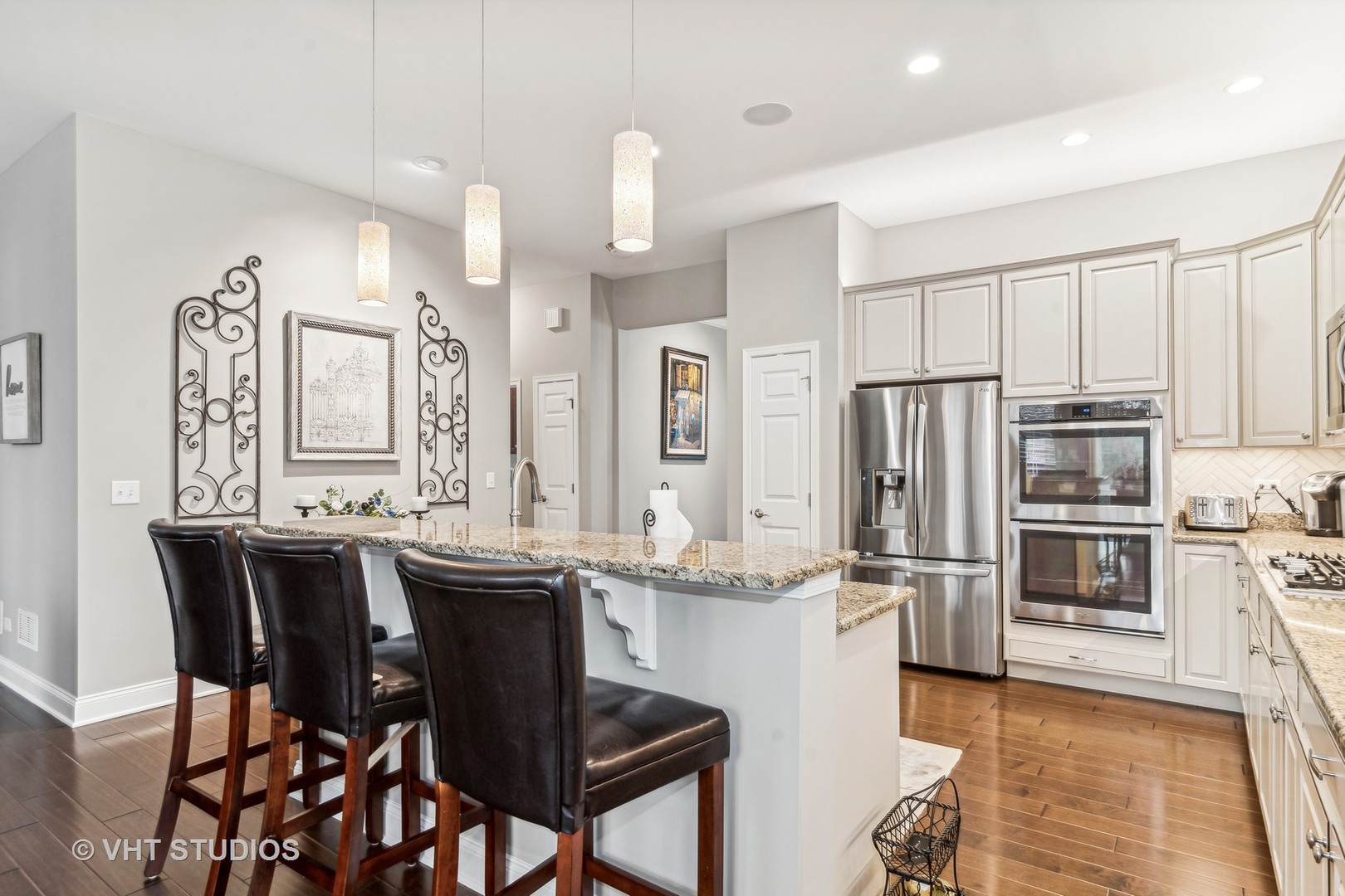 3870 Eagle Ridge Drive Elgin, IL 60124 - Photo 7 of 20 a kitchen with stainless steel appliances kitchen island granite countertop a sink and cabinets