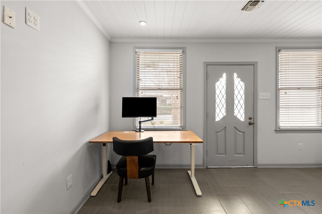 1902 North 7th Street Temple, TX 76501 - Photo 24 of 33 a view of a workspace with furniture and a window