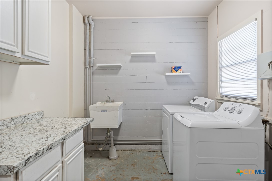 1902 North 7th Street Temple, TX 76501 - Photo 27 of 33 a utility room with sink dryer and washer
