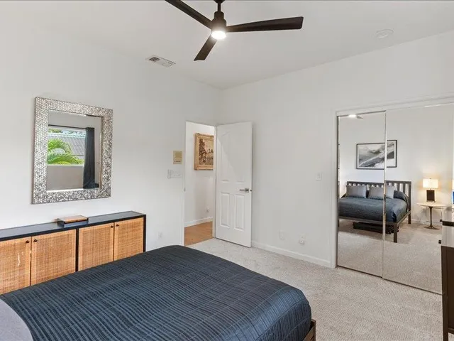 a bedroom with a bed and a chair