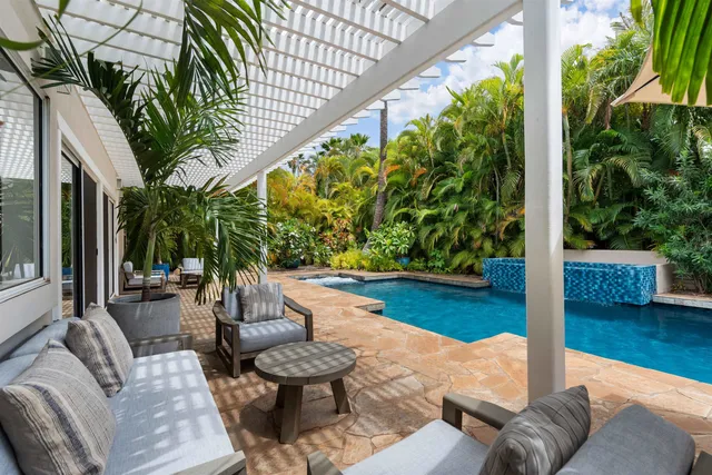 a balcony with chairs and a table