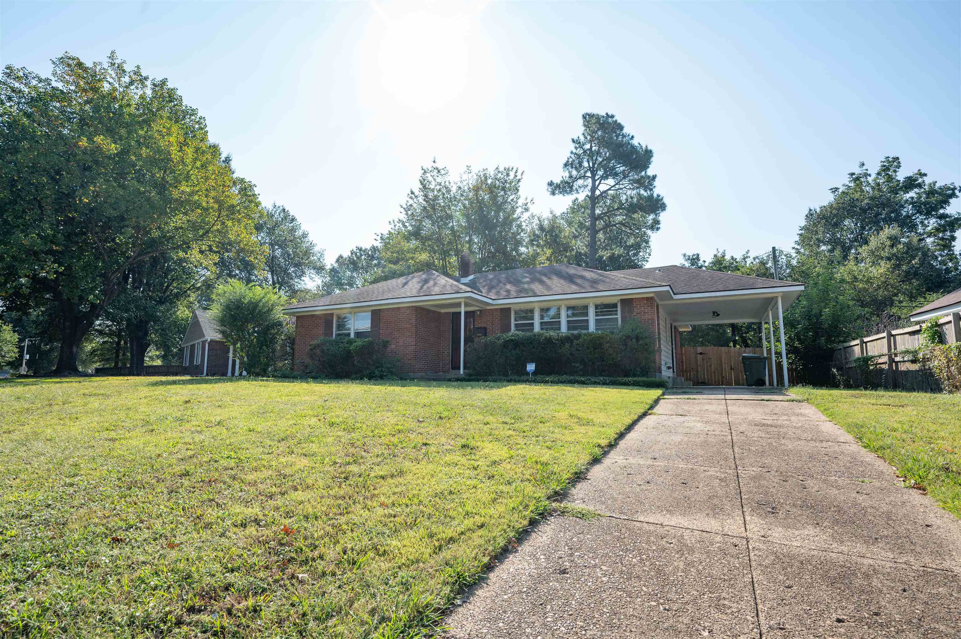 5189 Sea Isle Road Memphis, TN 38117 - Photo 15 of 16 Ranch-style home featuring a carport and a front yard