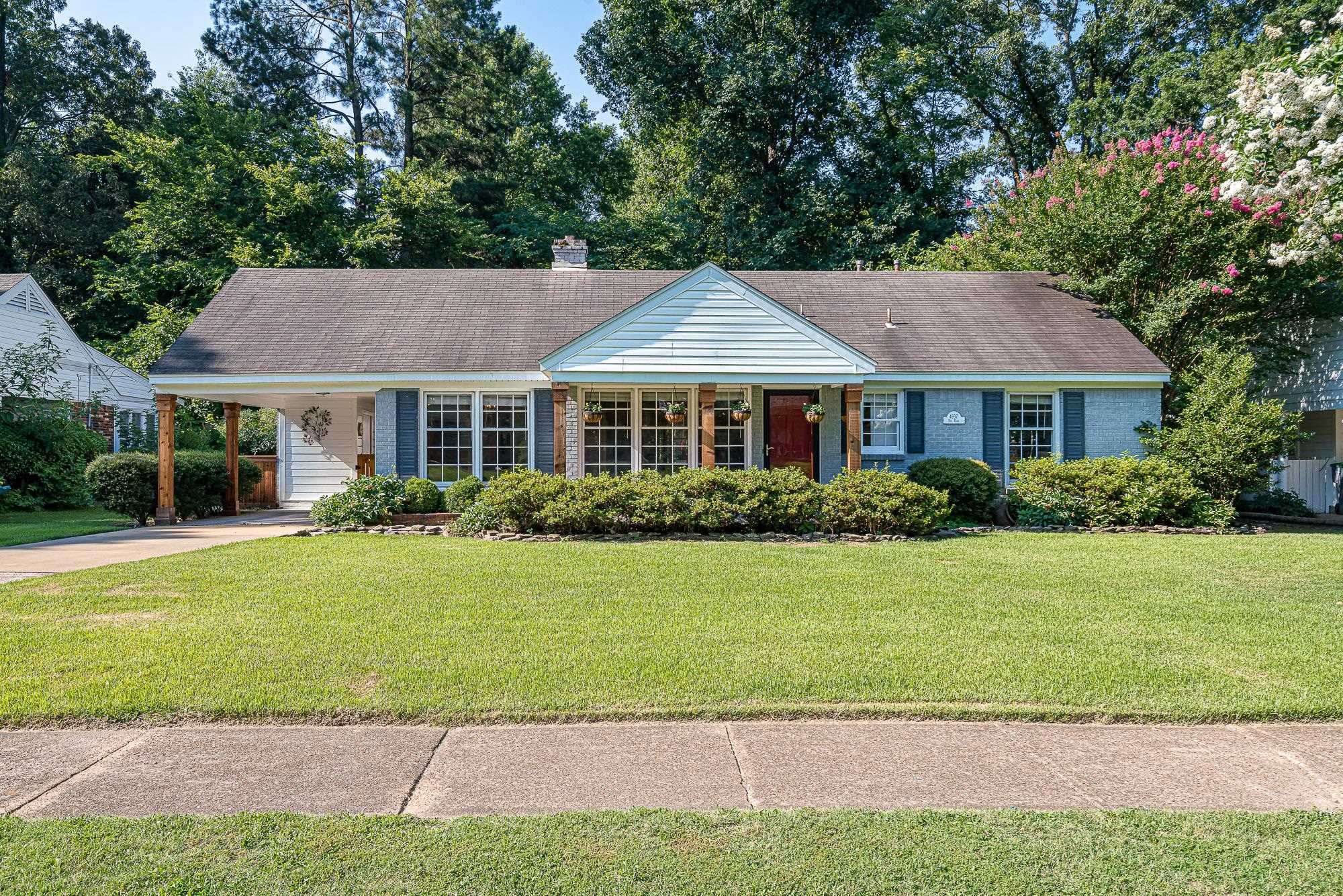 4937 Dee Road Memphis, TN 38117 - Photo 1 of 24 a front view of a house with a yard