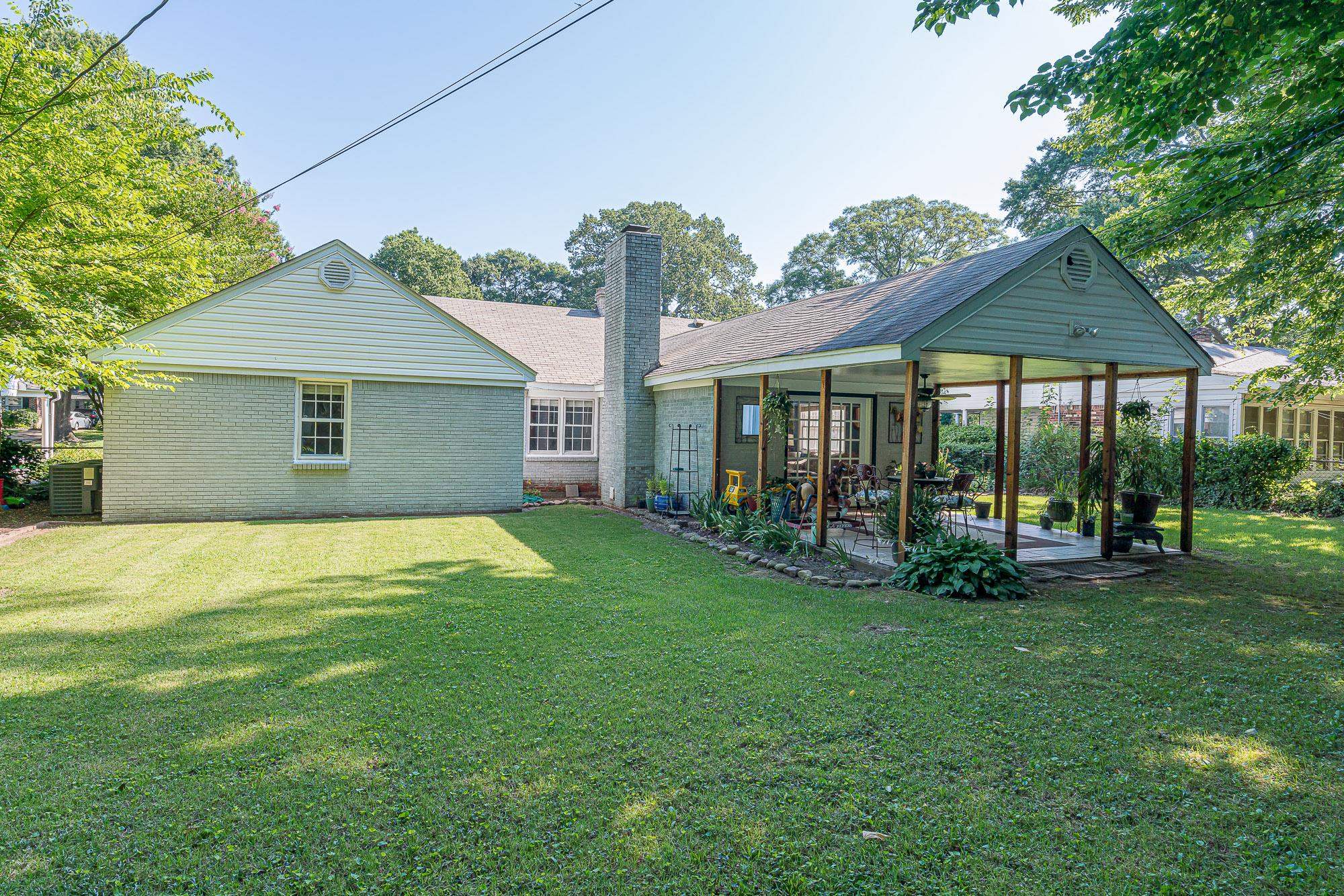 4937 Dee Road Memphis, TN 38117 - Photo 23 of 24 a view of a house with a yard and sitting area