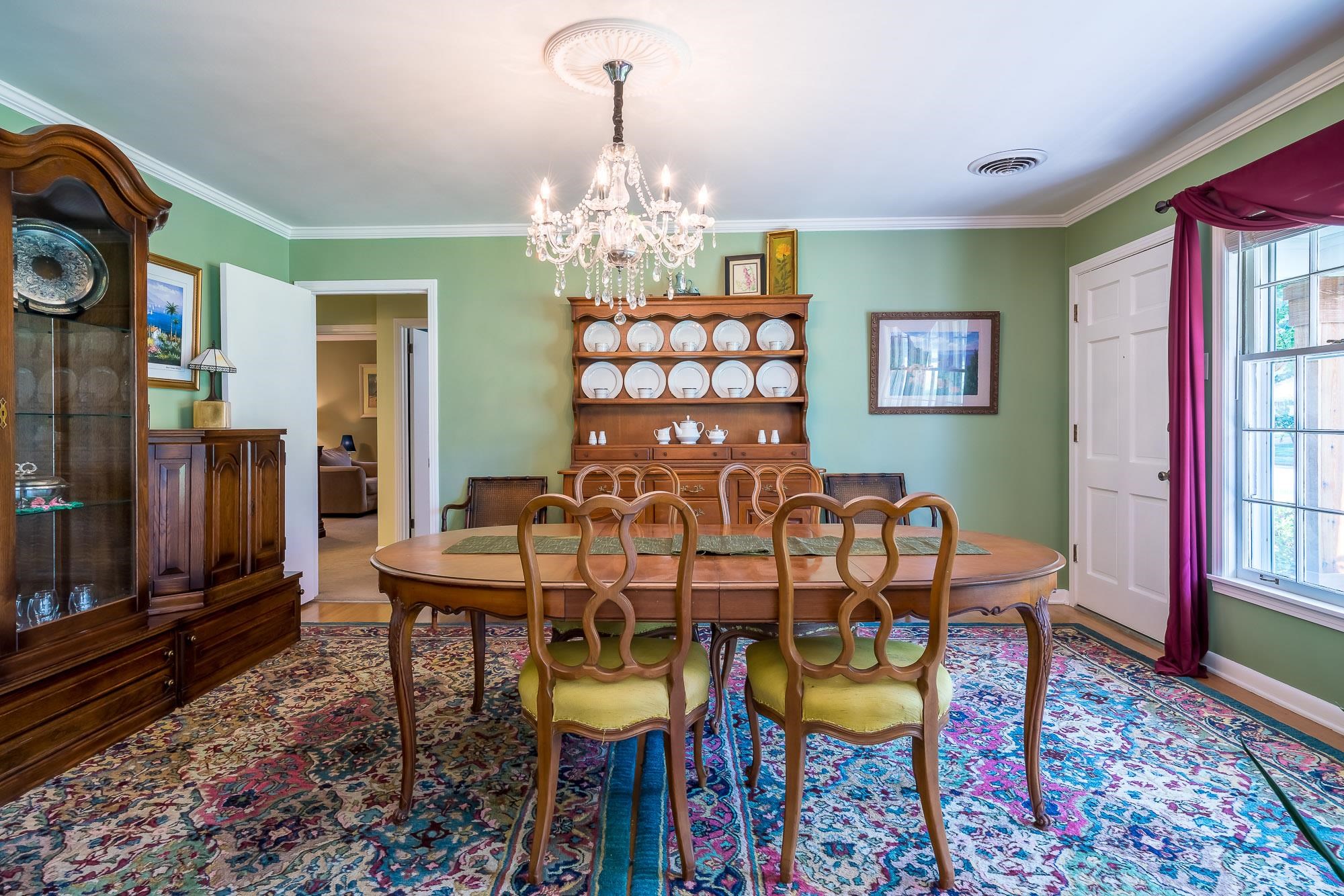 4937 Dee Road Memphis, TN 38117 - Photo 5 of 24 a view of a dining room with furniture and chandelier