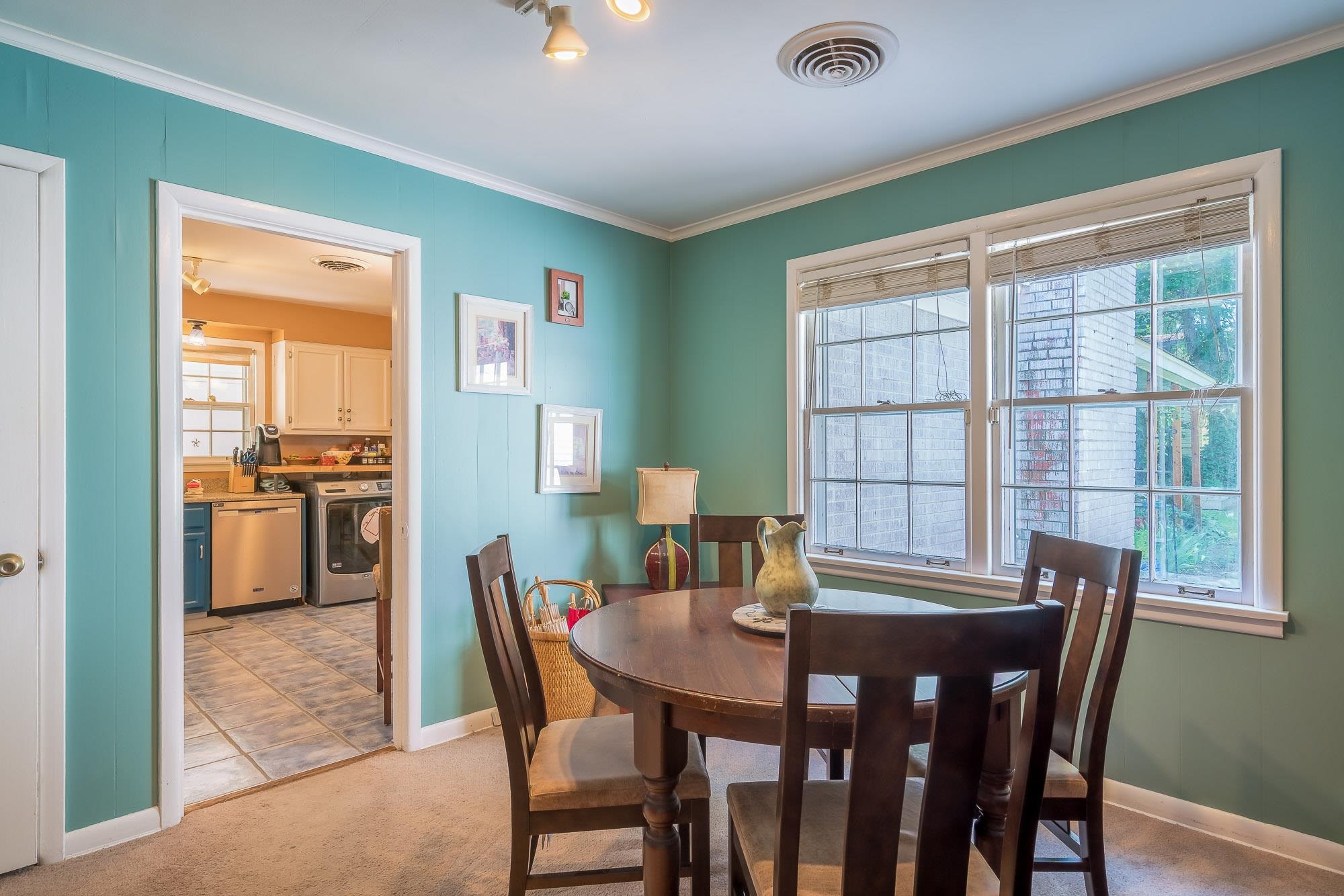4937 Dee Road Memphis, TN 38117 - Photo 7 of 24 a view of a dining room with furniture and a window