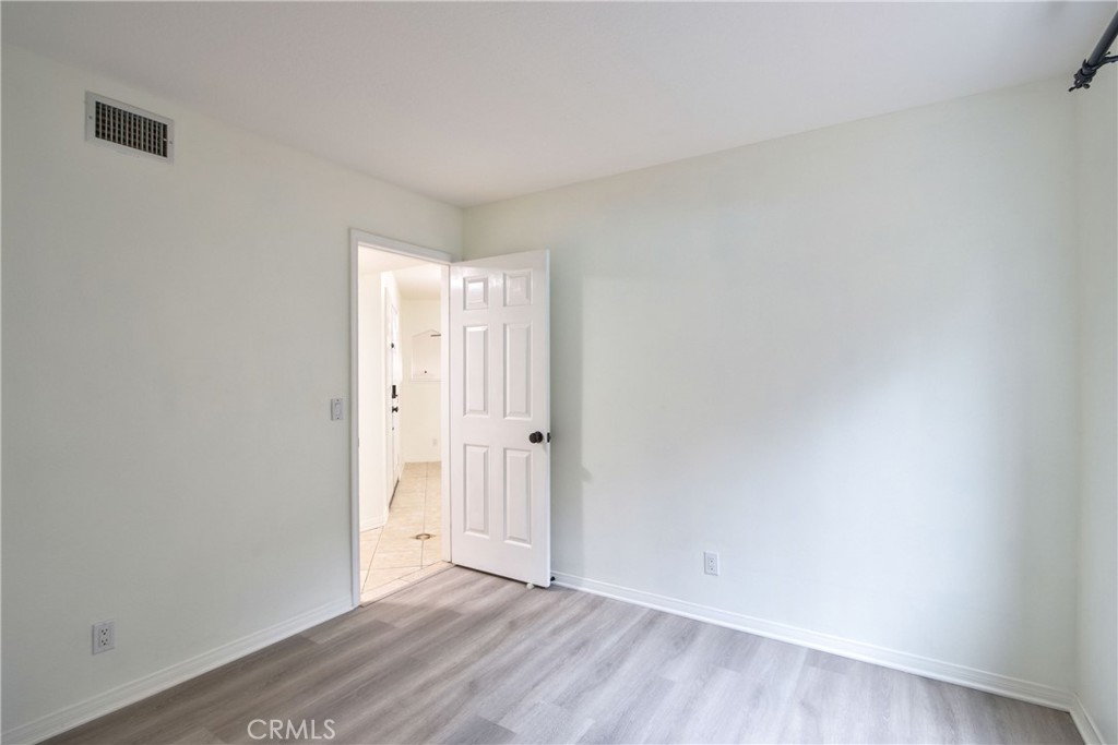 24055 Golden Pheasant Lane Murrieta, CA 92562 - Photo 16 of 38 a view of an empty room with wooden floor