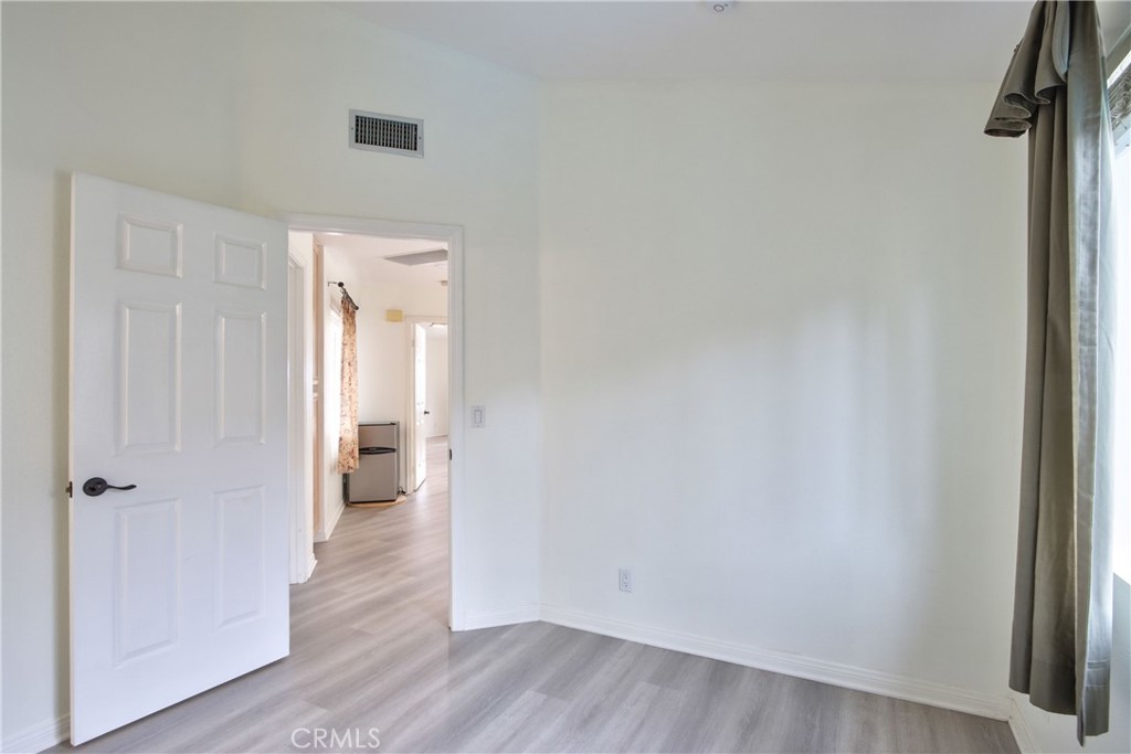 24055 Golden Pheasant Lane Murrieta, CA 92562 - Photo 26 of 38 a view of a room with wooden floor and a hallway