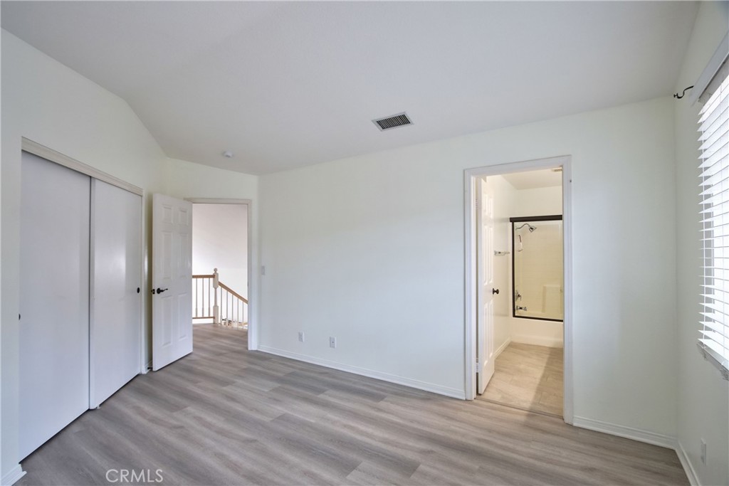 24055 Golden Pheasant Lane Murrieta, CA 92562 - Photo 29 of 38 a view of empty room with wooden floor and fan