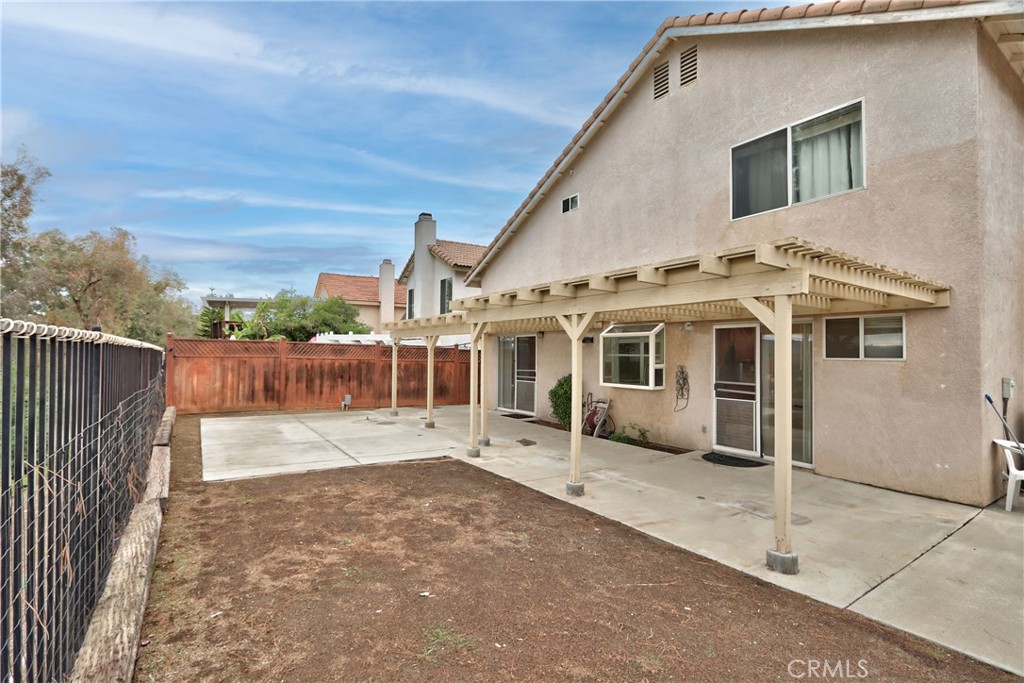 24055 Golden Pheasant Lane Murrieta, CA 92562 - Photo 32 of 38 a view of a house with a wooden fence