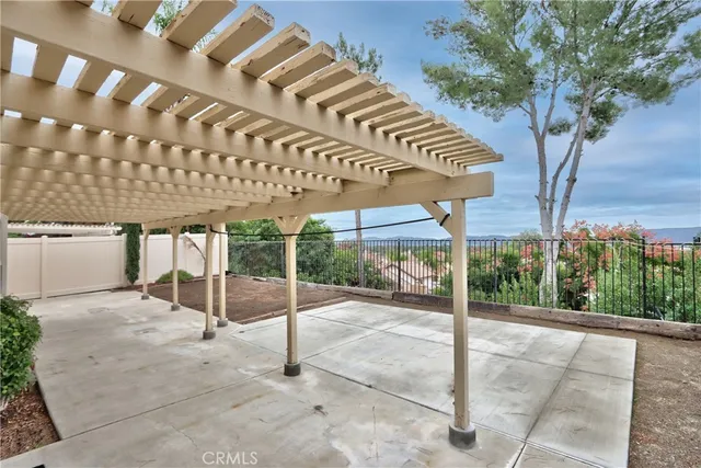 a view of a patio with table and chairs and potted plants