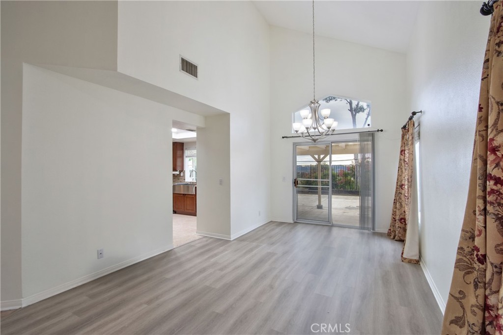 24055 Golden Pheasant Lane Murrieta, CA 92562 - Photo 4 of 38 a view of a room with wooden floor