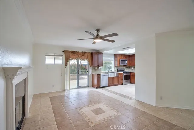 a view of a kitchen with a sink and a fireplace