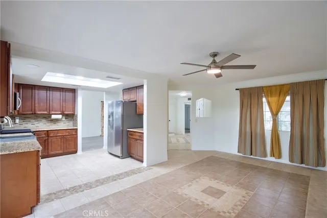 a view of a kitchen with a sink and a window