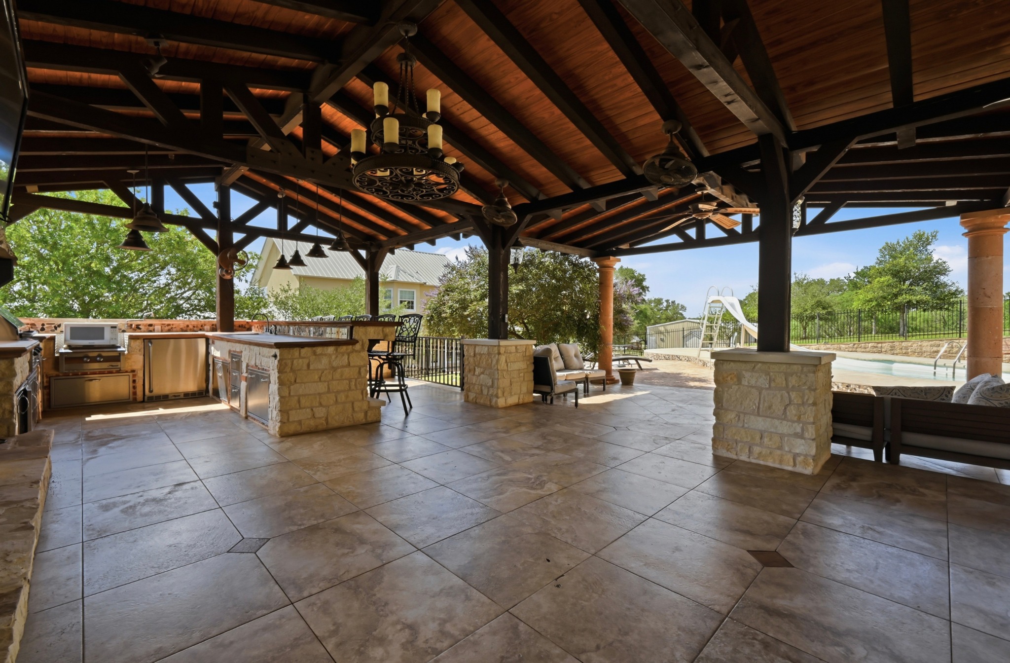 1175 Southern Way Luling, TX 78648 - Photo 38 of 40 An entertainer's dream, this covered patio offers an outdoor kitchen and ample space for relaxation by the pool.