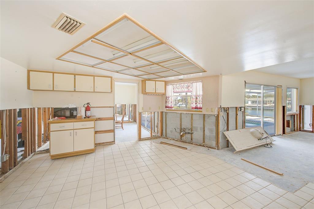 767 Island Way Clearwater, FL 33767 - Photo 15 of 74 a large white room with kitchen view