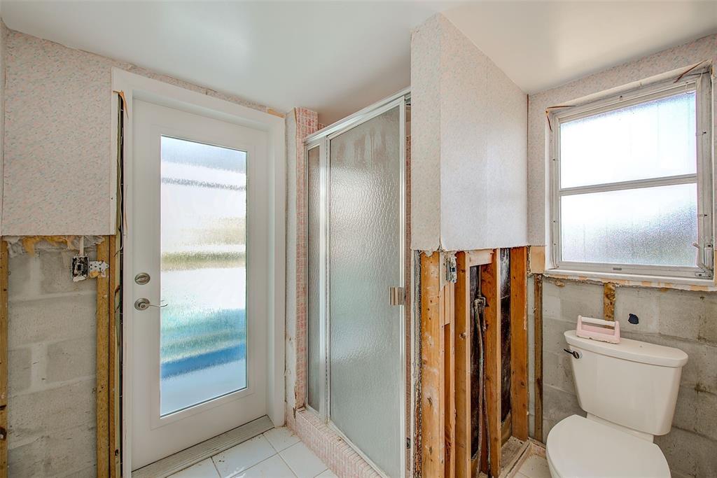 767 Island Way Clearwater, FL 33767 - Photo 29 of 74 a bathroom with a toilet and a shower