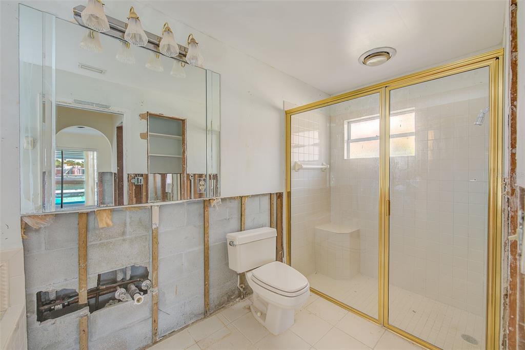 767 Island Way Clearwater, FL 33767 - Photo 34 of 74 a bathroom with a toilet a sink and shower