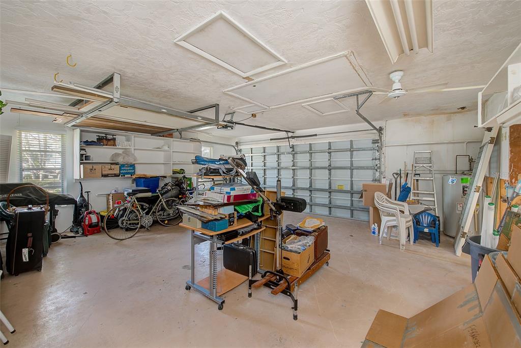 767 Island Way Clearwater, FL 33767 - Photo 37 of 74 a view of a garage with a bike and car