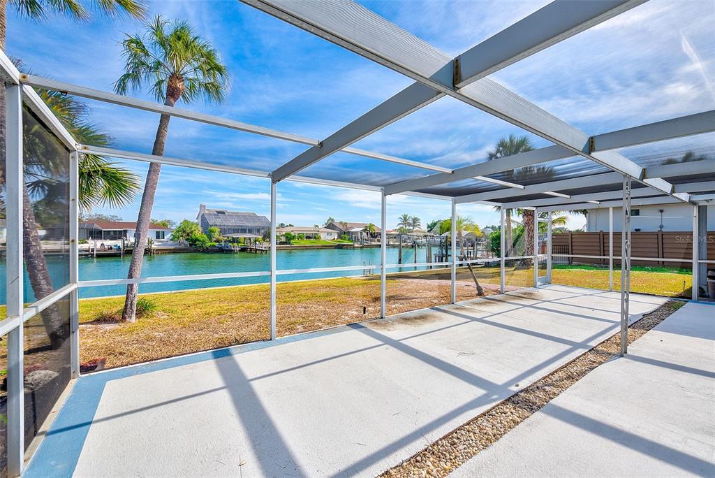 767 Island Way Clearwater, FL 33767 - Photo 43 of 74 a view of a backyard with a swimming pool