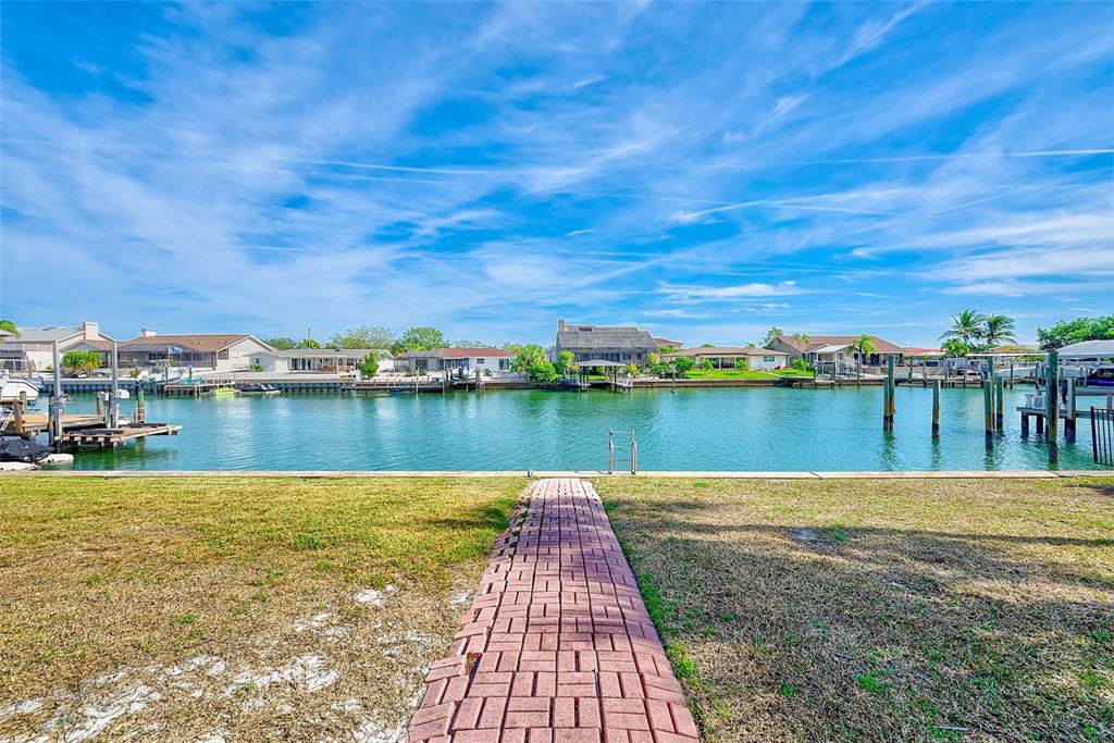 767 Island Way Clearwater, FL 33767 - Photo 44 of 74 a view of a lake with houses in the back