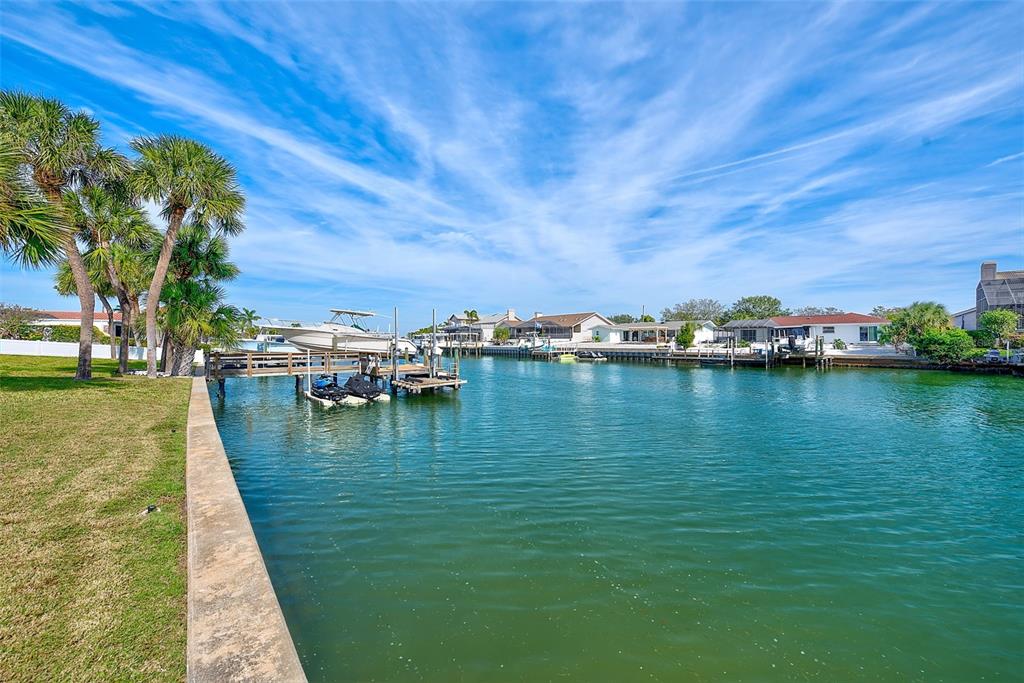 767 Island Way Clearwater, FL 33767 - Photo 46 of 74 a view of a lake with houses in the back