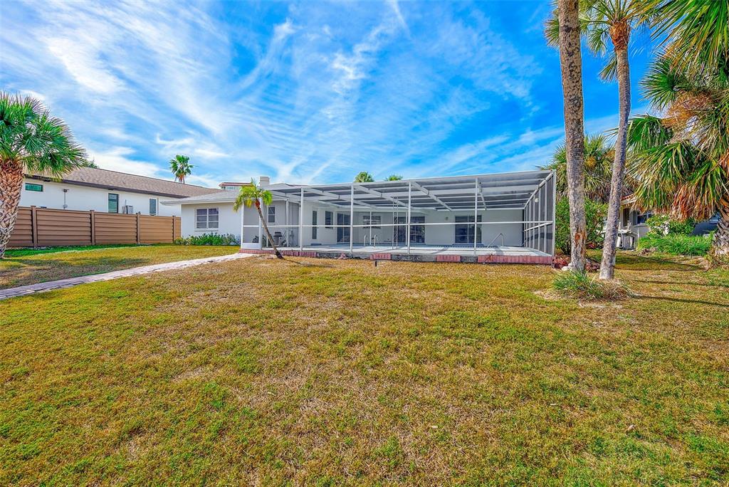 767 Island Way Clearwater, FL 33767 - Photo 50 of 74 a view of a house with a yard and sitting area
