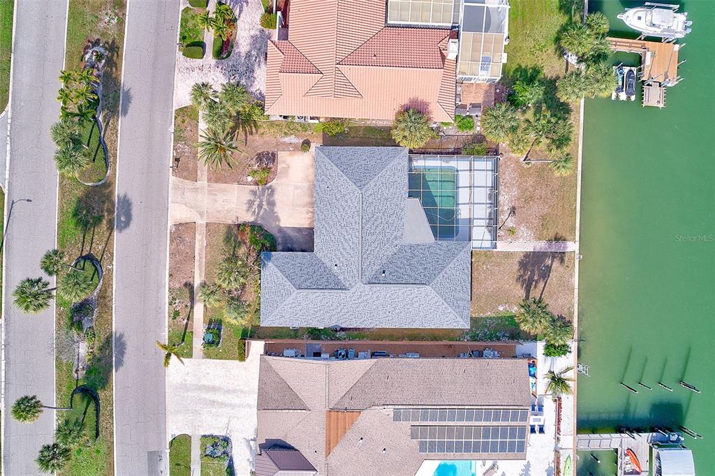 767 Island Way Clearwater, FL 33767 - Photo 54 of 74 an aerial view of a house with a garden and plants