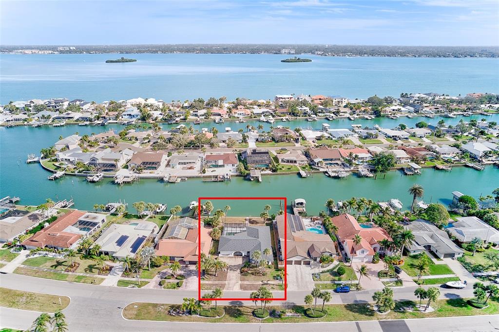 767 Island Way Clearwater, FL 33767 - Photo 55 of 74 an aerial view of a city with lots of residential buildings lake and ocean view
