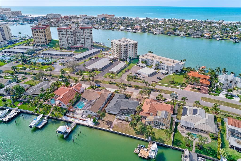 767 Island Way Clearwater, FL 33767 - Photo 58 of 74 an aerial view of residential houses with outdoor space and lake view