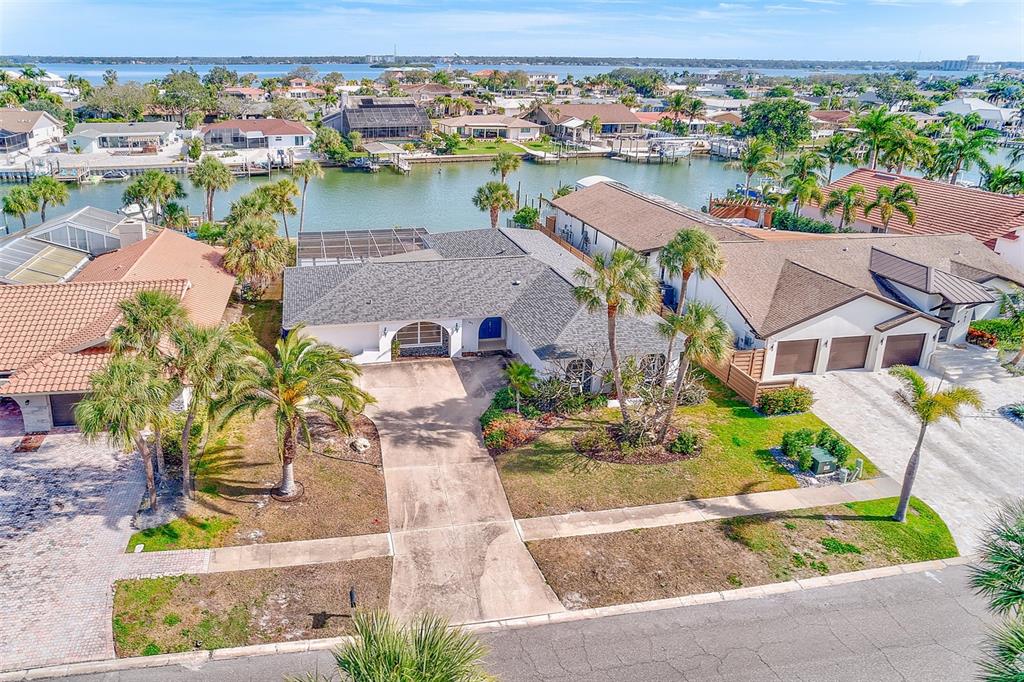 767 Island Way Clearwater, FL 33767 - Photo 70 of 74 an aerial view of residential houses with outdoor space and lake view