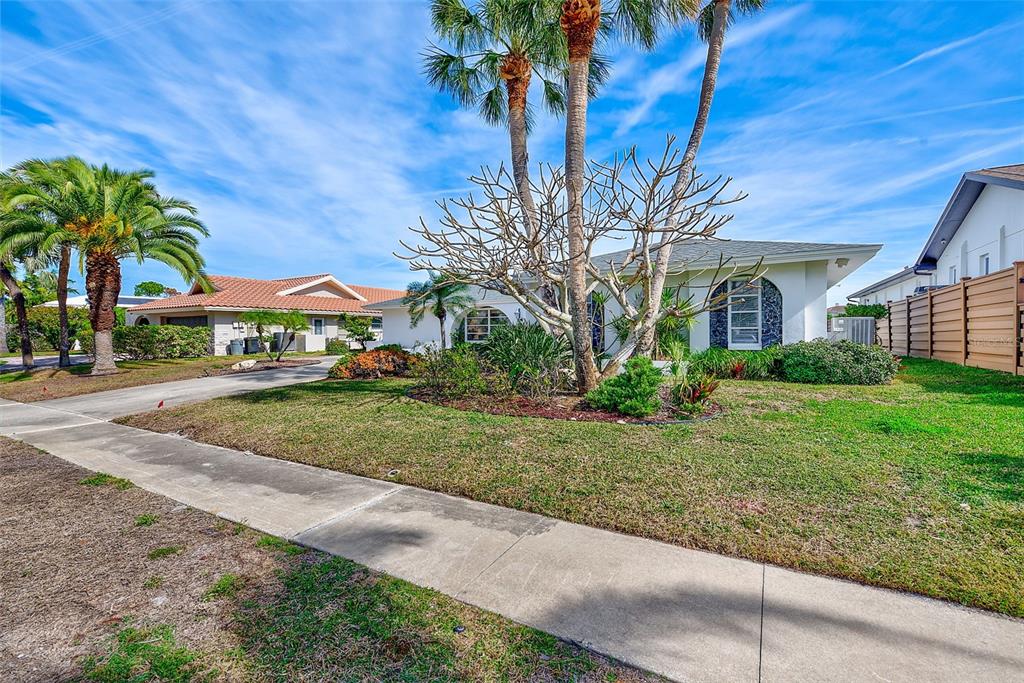 767 Island Way Clearwater, FL 33767 - Photo 72 of 74 a view of multiple houses with yard and green space