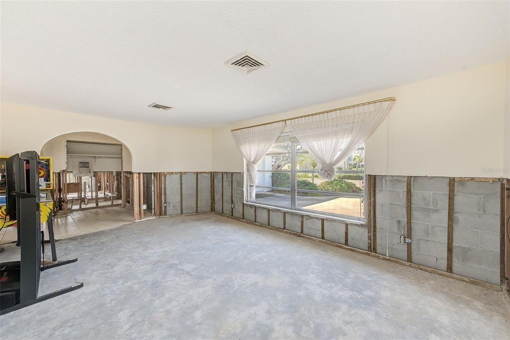 767 Island Way Clearwater, FL 33767 - Photo 9 of 74 an empty room with sliding door and outer view