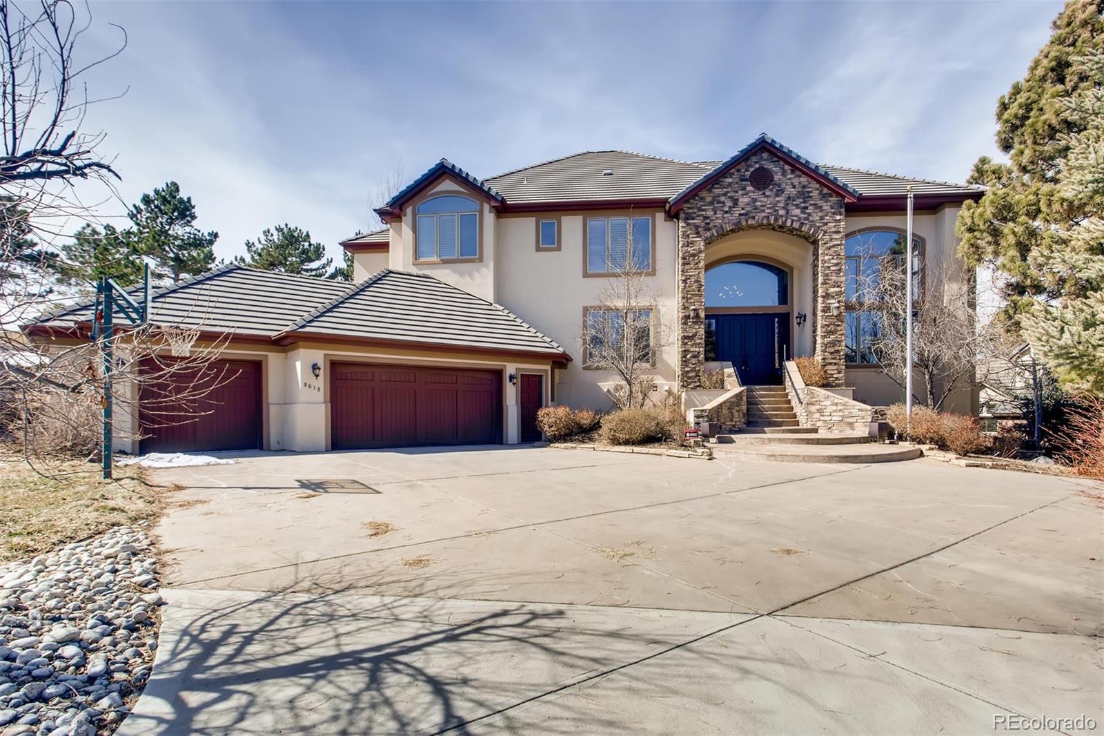 8618 Colonial Drive Lone Tree, CO 80124 - Photo 1 of 39 a front view of a house with yard
