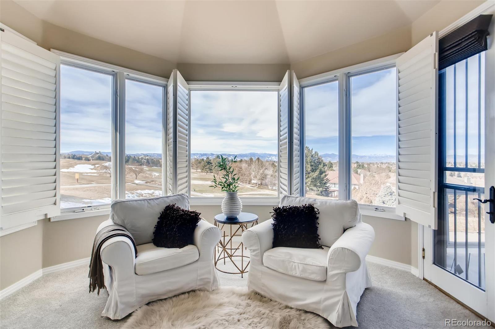8618 Colonial Drive Lone Tree, CO 80124 - Photo 19 of 39 a living room with furniture and a large window