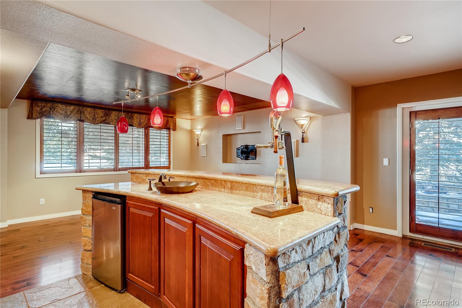 8618 Colonial Drive Lone Tree, CO 80124 - Photo 28 of 39 a kitchen with a sink and a refrigerator