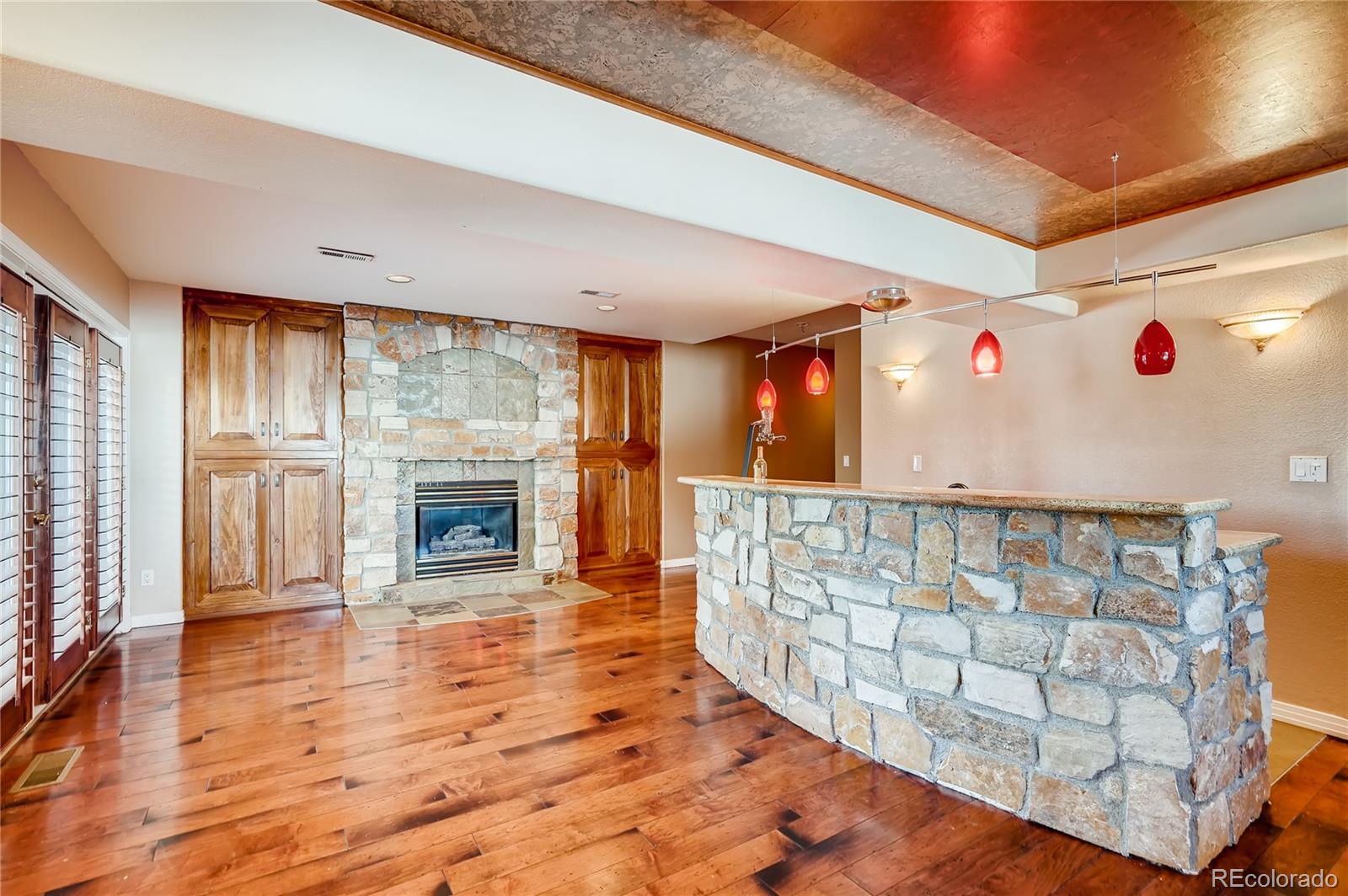8618 Colonial Drive Lone Tree, CO 80124 - Photo 29 of 39 a view of an entryway with wooden floor
