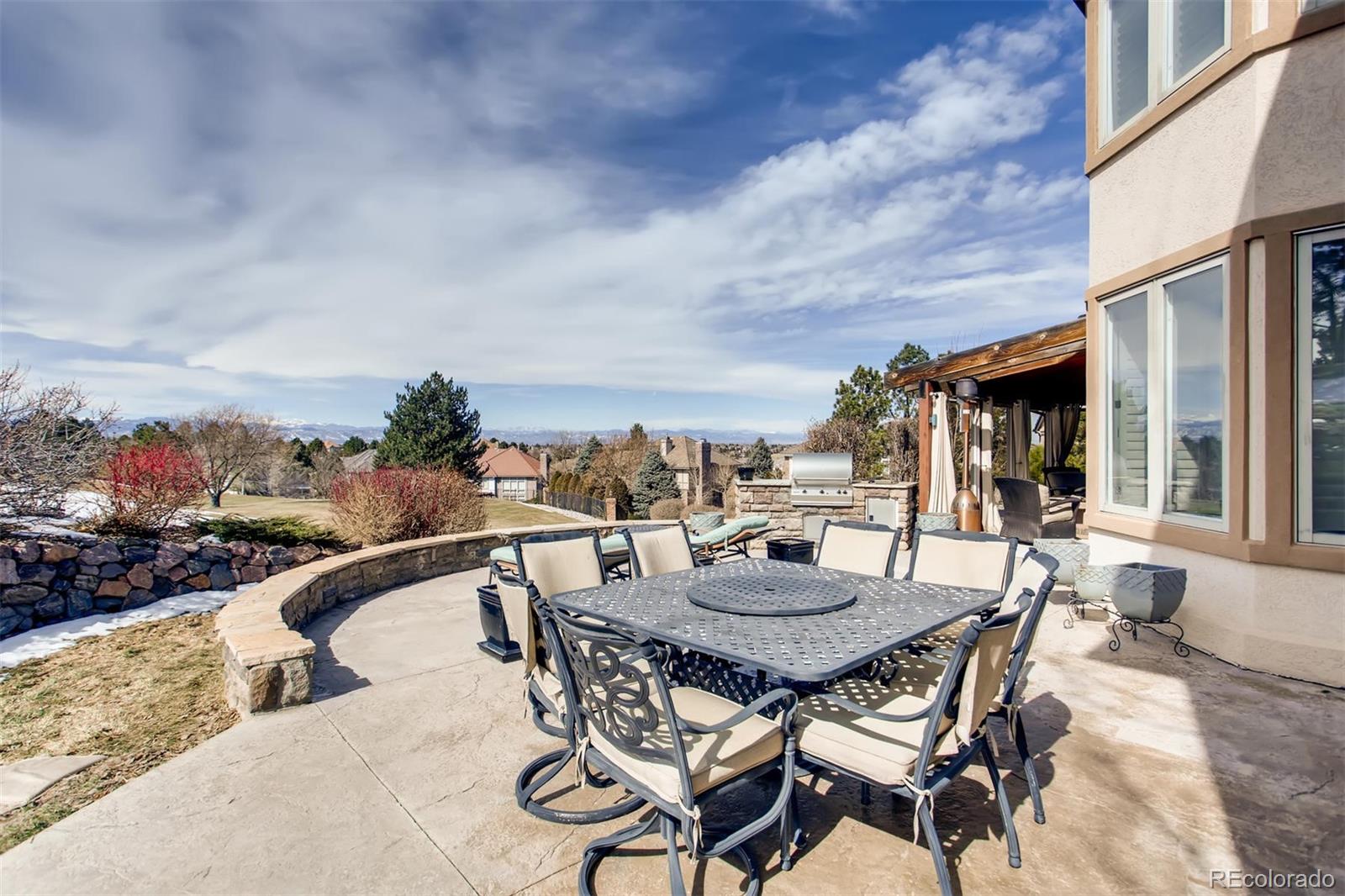 8618 Colonial Drive Lone Tree, CO 80124 - Photo 36 of 39 a view of a dinning table and chairs in the patio
