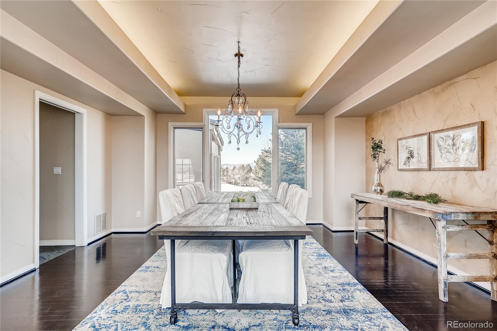 8618 Colonial Drive Lone Tree, CO 80124 - Photo 5 of 39 a view of a dining room with furniture window and wooden floor