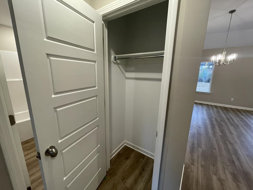 102 Stone Brook Cove Ripley, TN 38063 - Photo 11 of 19 a view of a hallway with wooden floor