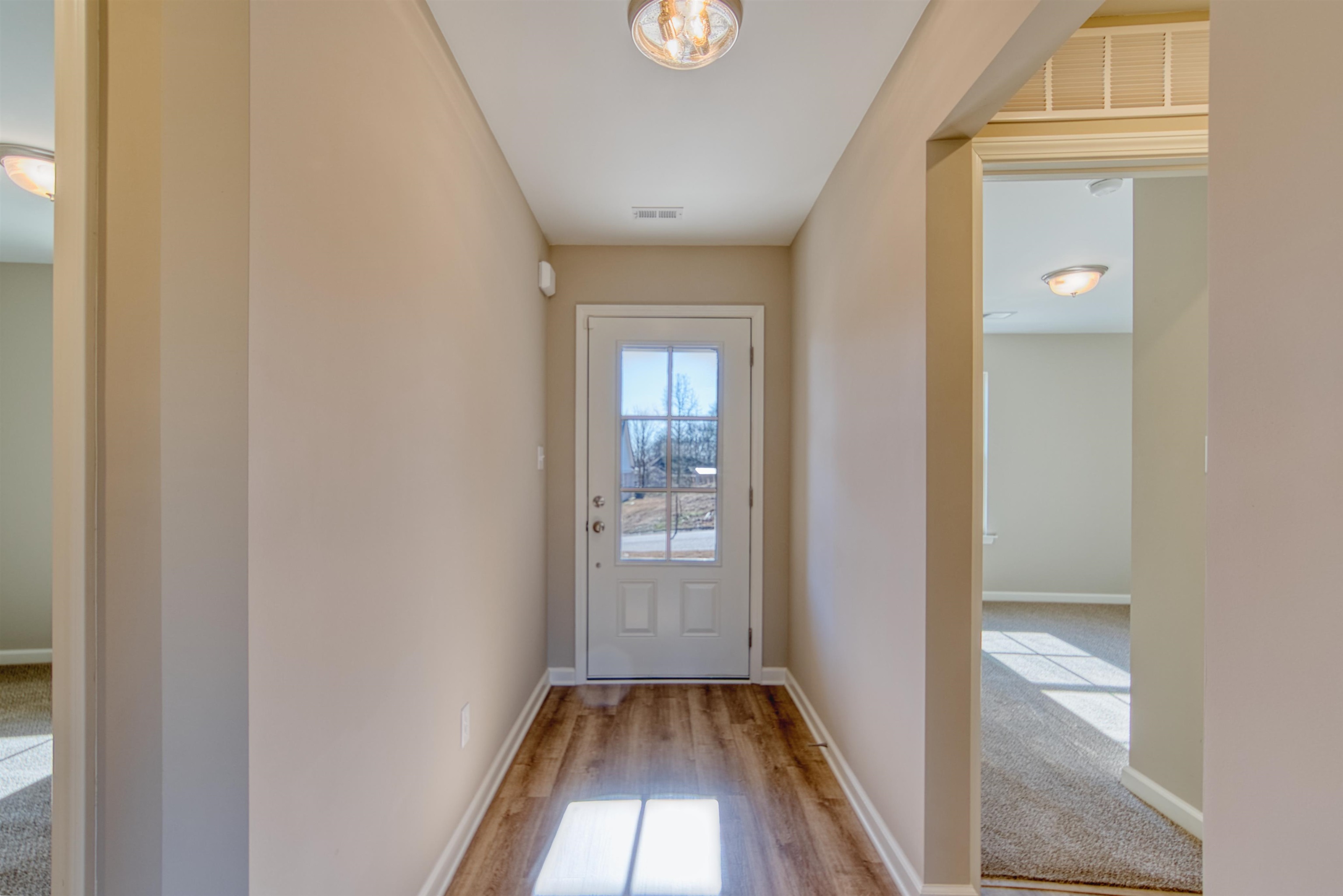 102 Stone Brook Cove Ripley, TN 38063 - Photo 15 of 32 a view of livingroom with hallway