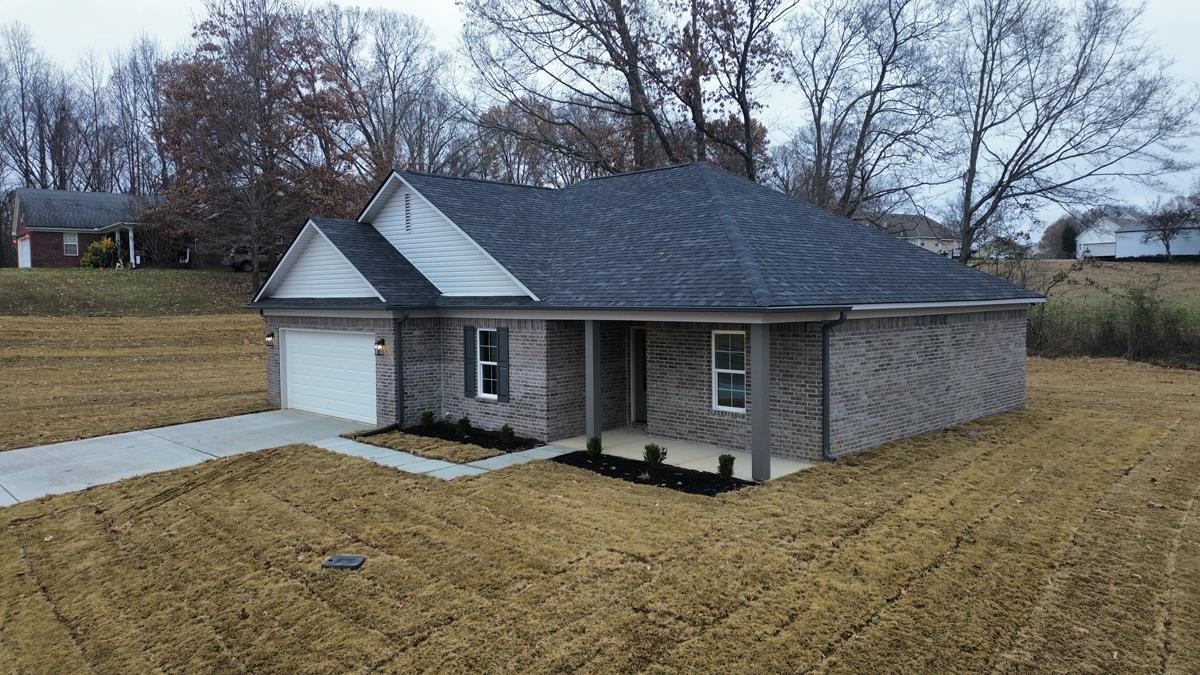 102 Stone Brook Cove Ripley, TN 38063 - Photo 15 of 19 a front view of a house with a yard