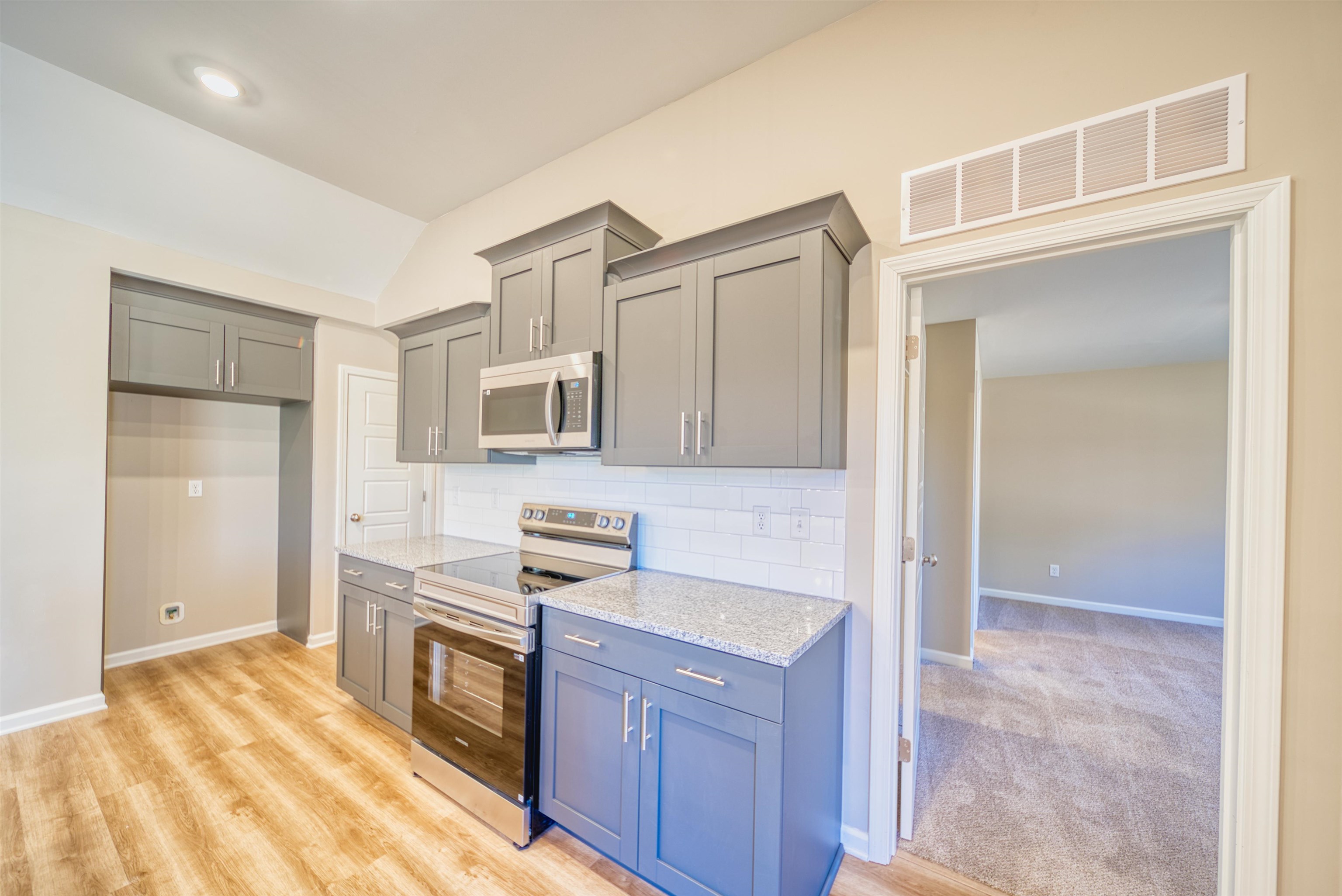 102 Stone Brook Cove Ripley, TN 38063 - Photo 24 of 32 a kitchen with stainless steel appliances granite countertop a refrigerator and a sink