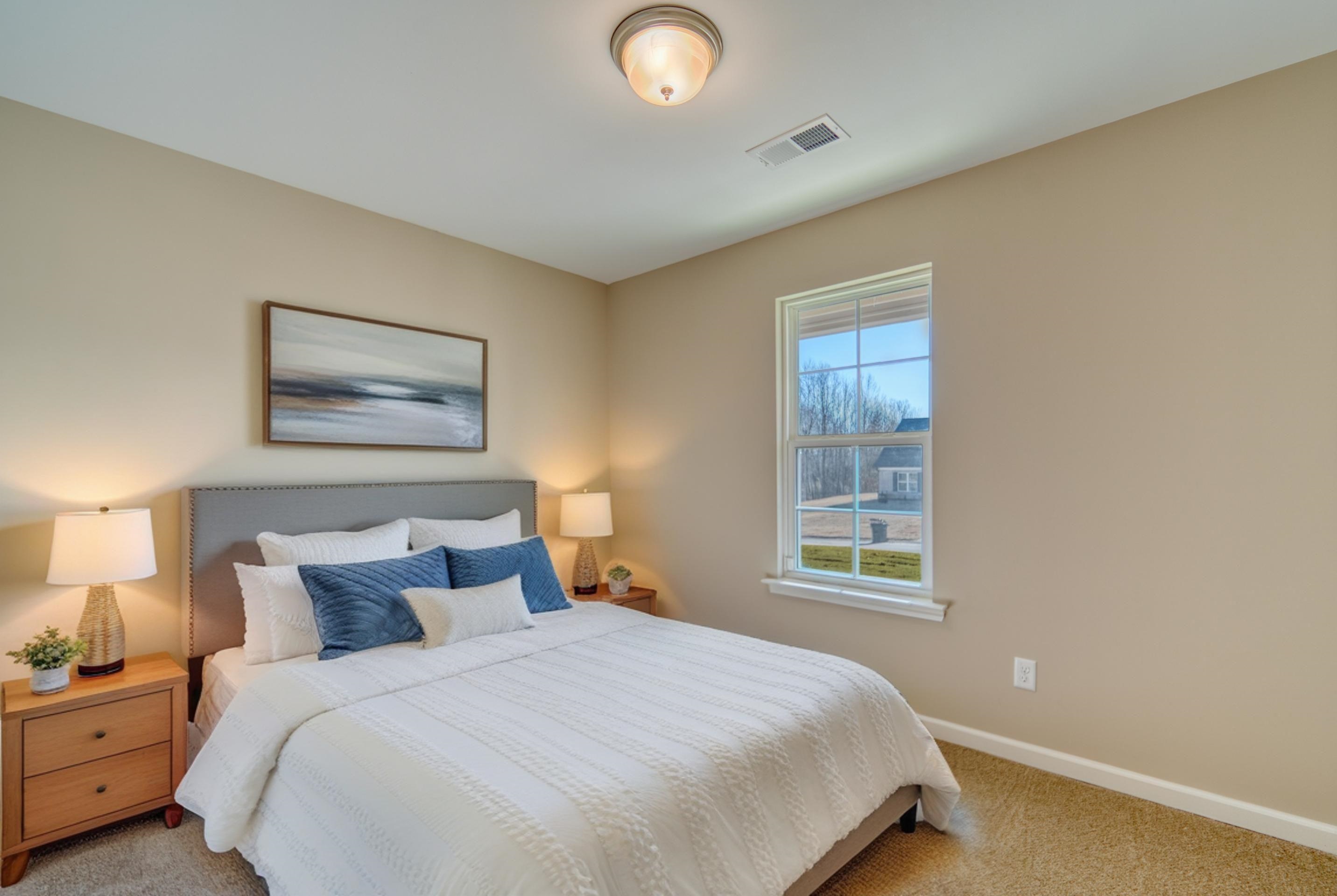 102 Stone Brook Cove Ripley, TN 38063 - Photo 4 of 32 a bedroom with a bed and a window
