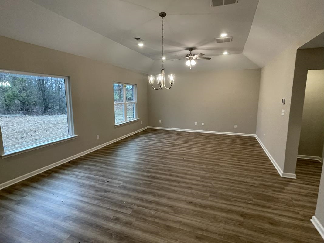 102 Stone Brook Cove Ripley, TN 38063 - Photo 4 of 19 wooden floor in an empty room with a window