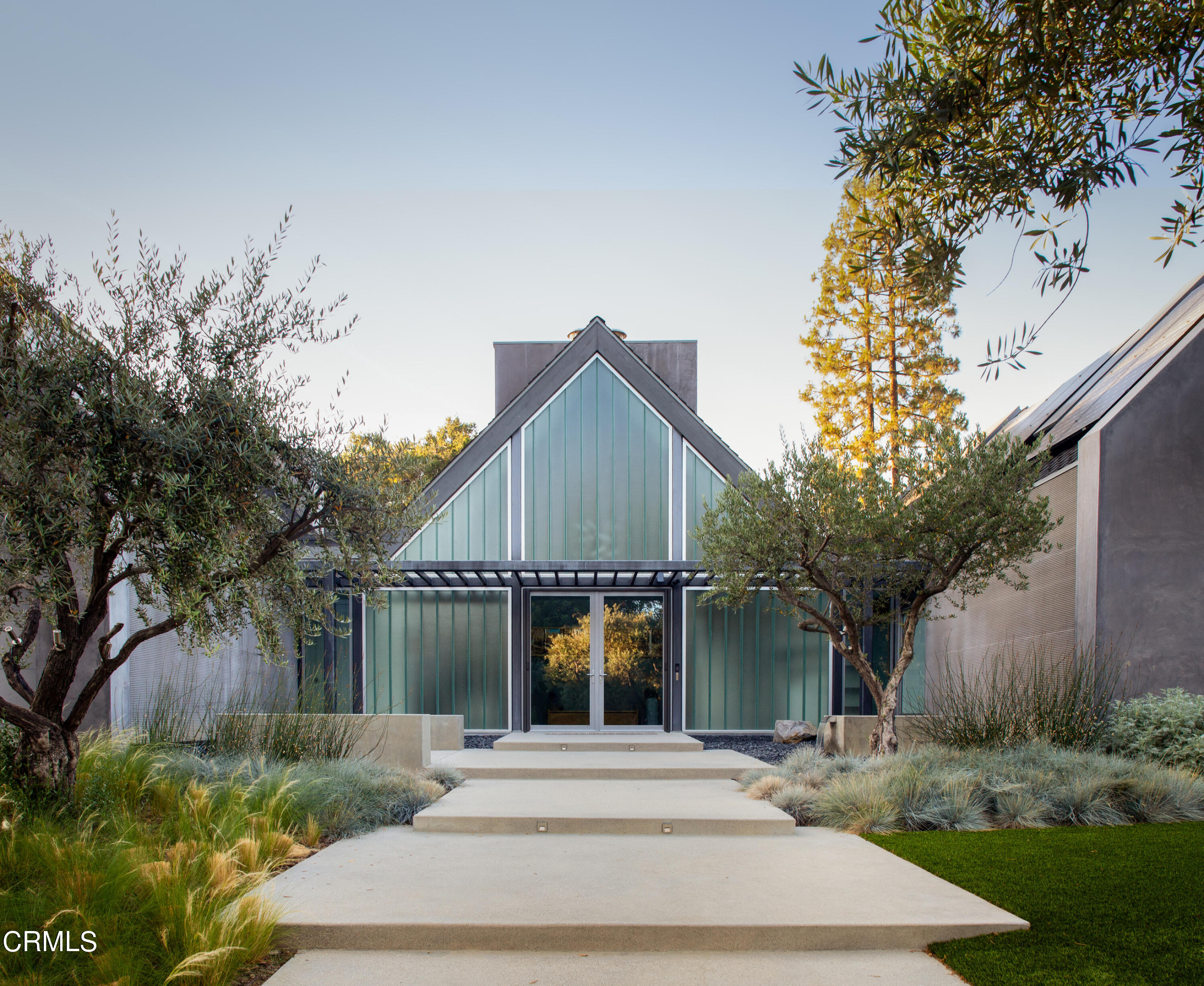 561 Woodland Road Pasadena, CA 91106 - Photo 1 of 1 a front view of a house with a yard and potted plants